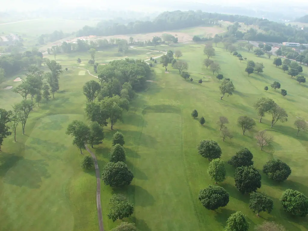 The Founders Course from above at last light, the fairways green against the foothills